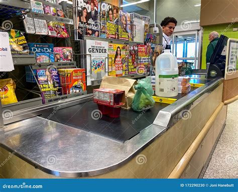 A Checkout Counter with Food on the Counter of Publix Grocery Store Editorial Image - Image of ...