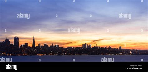 San Francisco skyline at sunset with dramatic clouds Stock Photo - Alamy