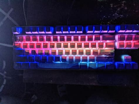 My first custom keyboard! I tried to make the lighting match the caps ...