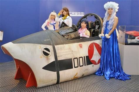 some women are standing in front of an airplane