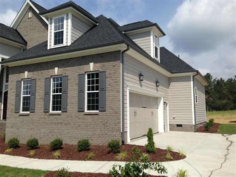 Gray Gutters Jarman Homes | White brick houses, Grey brick houses, House exterior