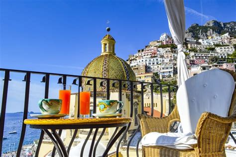 balcony of the living room overlooking the village and the beach | Renting a house, Positano, Italy