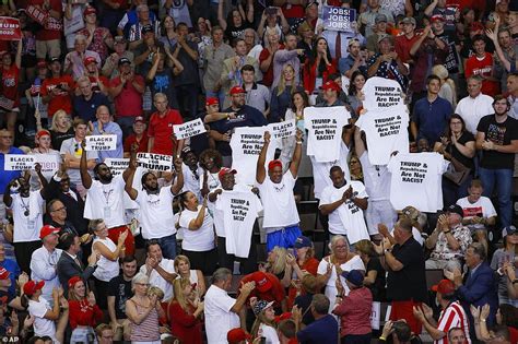 Protesters unfurl Spanish banner saying 'F*** ICE' at Trump rally | Daily Mail Online