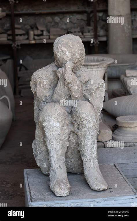 Human body plaster cast, ancient victim of the Vesuvius volcano eruption at Mensa Ponderaria in ...