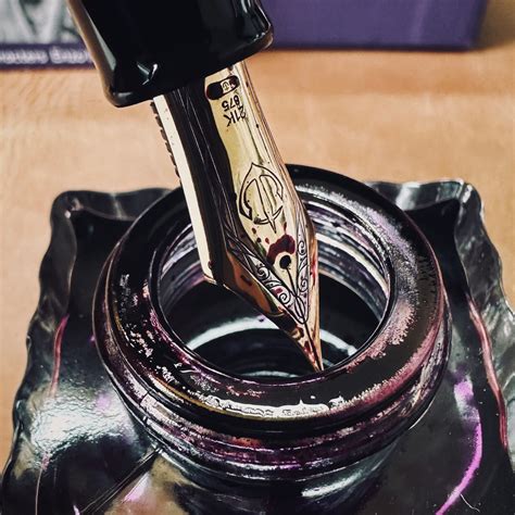 Fountain pen nibs look their best when coming out of an ink bottle : r/fountainpens