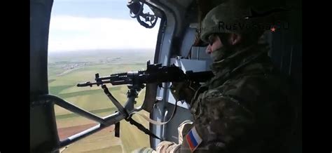 A Spetsnaz/Razvedchik door gunner with an AK-12, on a Russian Mi-17 helicopter in Ukraine ...