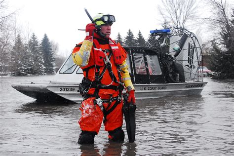 Coast Guard rescue swimmer radios helicopter during search… | Flickr