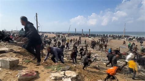 People flee gunfire on Gaza City beach as people collect aid | World ...