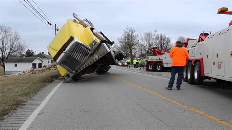 Overturned Semi Lifted By Tow Trucks - YouTube