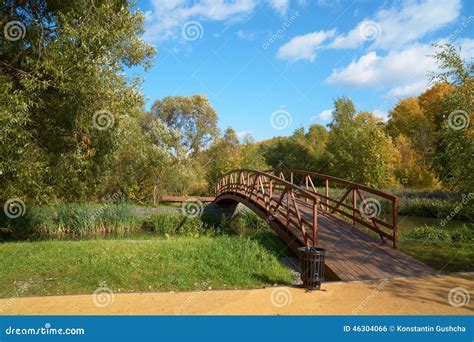 Wooden Bridge Across Small River Stock Photo - Image of chermyanka ...