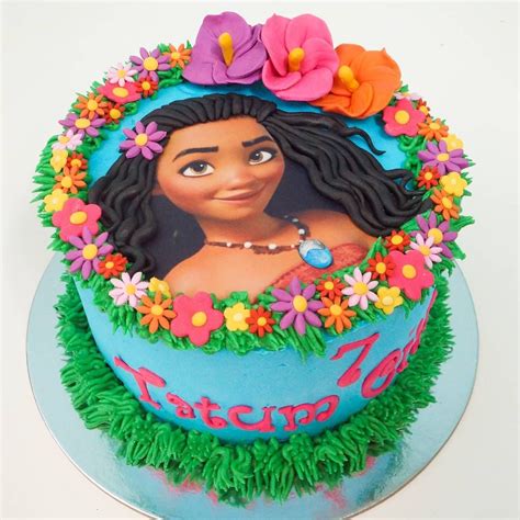 there is a cake decorated with an image of princess pocahon on the top