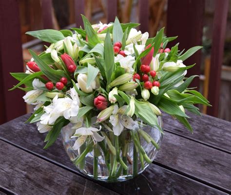 Fluffy airy flower arrangement with alstroemerias, tulips, hypericum. | Tulips arrangement ...