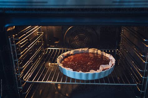 Chocolate Cake Baking in the Oven by Lumina - Stocksy United