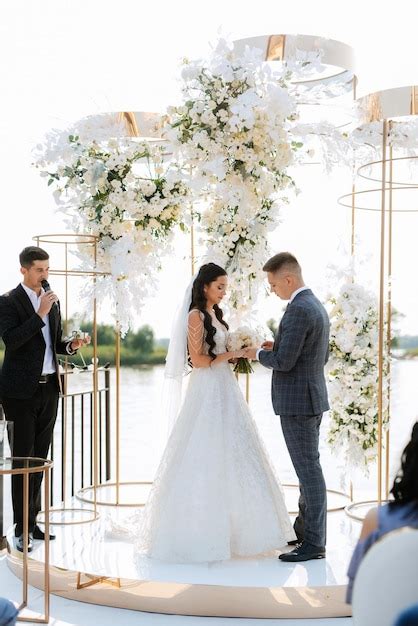 Premium Photo | Wedding ceremony of the newlyweds on the pier