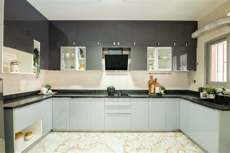 Modular U-Shaped Kitchen Design With A Black Granite Countertop | Livspace