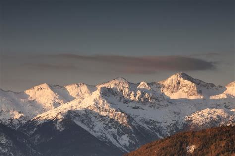 Premium Photo | Mountain peaks in winter at sunrise