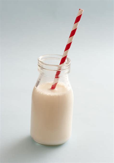 Free Stock Photo 13003 Small glass bottle full of milk with a straw | freeimageslive