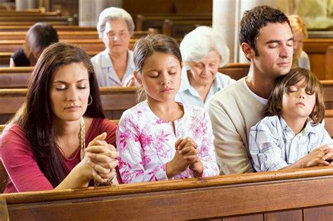 Family Praying At Church