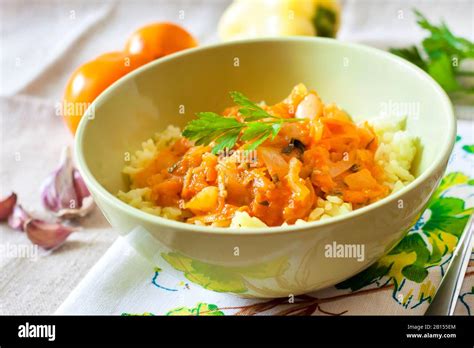 Steamed rice with stewed vegetables and turmeric Stock Photo - Alamy