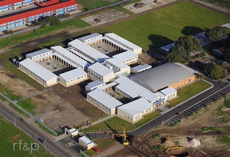 an aerial view of a building with construction equipment in the foreground