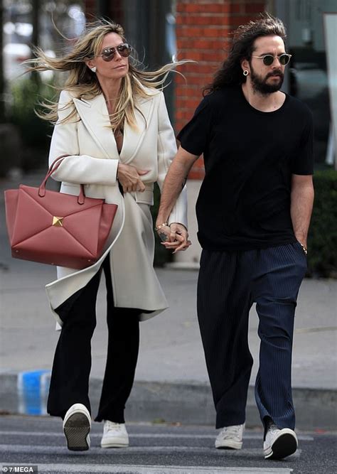 Heidi Klum and Tom Kaulitz pack on PDA while out shopping on windy day on fourth wedding ...