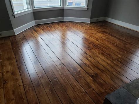 Our 130 year old heartwood pine floors stained with Minwax Provincial stain and semigloss poly ...