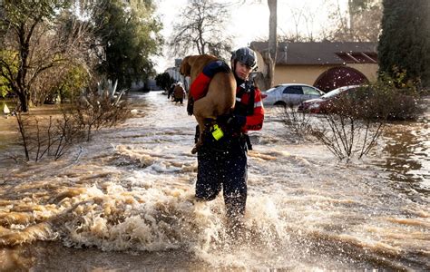 Tens of thousands evacuate California storms, with 17 dead