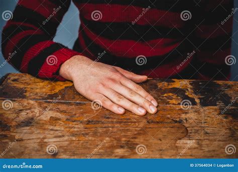 Young Man Resting His Hand On A Table Stock Photography | CartoonDealer.com #37564034