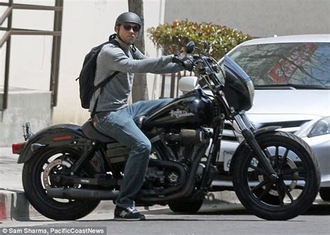 Scruffy Charlie Hunnam takes his Harley out for a ride in Los Angeles ...