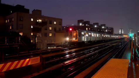 An elevated NYC subway train at night - YouTube