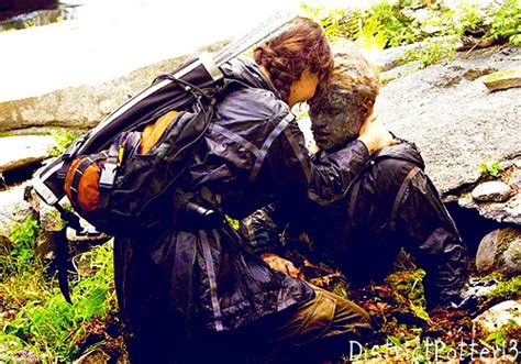 Katniss Finds Peeta Camouflaged by DistrictPotter13 on DeviantArt