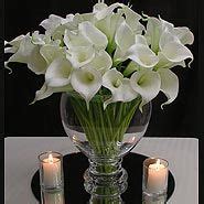 Floating candle centerpiece ideas | Calla lily centerpieces, Lily ...
