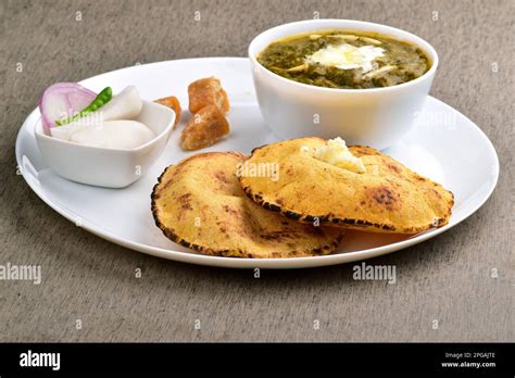 Traditional punjabi food sarson ka saag with makki ki roti served with ...