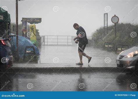 Man walking in the rain editorial image. Image of drenched - 99397050