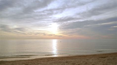 Sunrise beach. Idyllic scene of sea sunrise. Sea waves slowly splashing ...