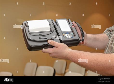 Man Holding Portable Barcode Printer and Scanner Set Device Stock Photo - Alamy