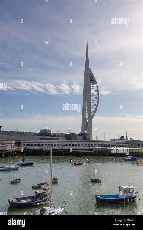 Portsmouth Harbour railway station with the Spinnaker Tower beyond, seen from across the harbour ...