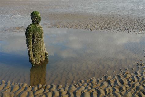 Antony Gormley [UK] (b 1950) ~ "ANOTHER PLACE", 2005-2006. Cast iron. Installation view, Crosby ...