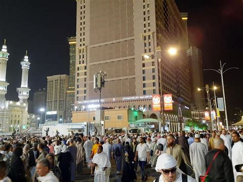 Mecca, Saudi Arabia, April 2023 - A beautiful view of pilgrims, tall buildings and lights at ...