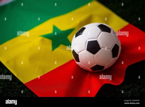 Senegal national football team. National Flag on green grass and soccer ball. Football wallpaper ...