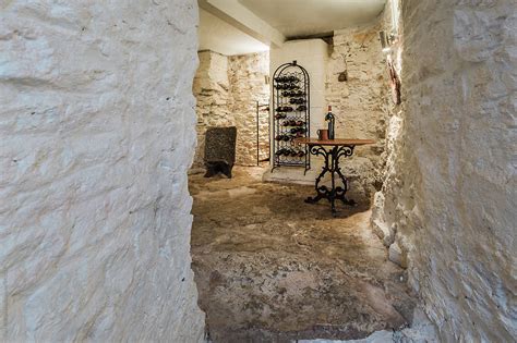 "Wine Cellar In The Basement Of An Old House" by Stocksy Contributor "Paul Phillips" - Stocksy