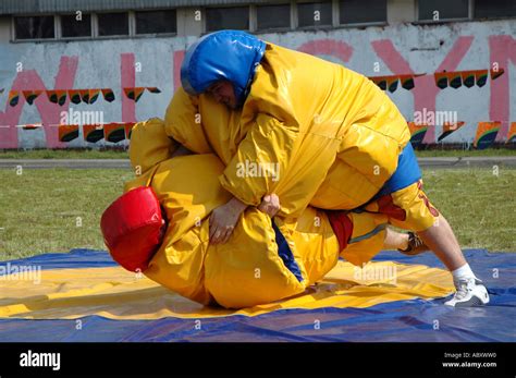 Funny sumo fighting parody in special costumes Stock Photo - Alamy