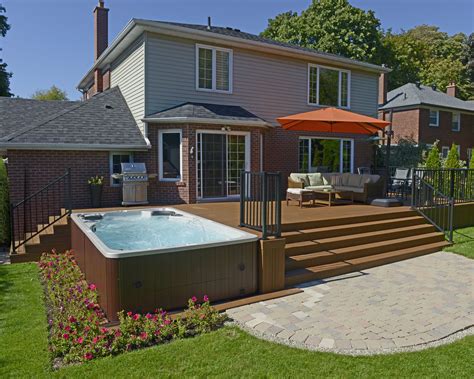 Hydropool Self Cleaning swim spa installed next to a deck Swim Spa Deck, Swim Spa Landscaping ...