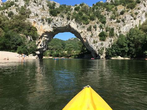 Kayaking in southern France under two bridges, the Pont d’Arc and Pont du Gard, offers ...