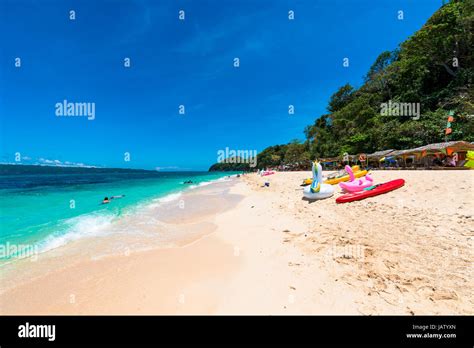 Sports and other activities at Puka Beach, Boracay Island, Philippines. People have fun at the ...