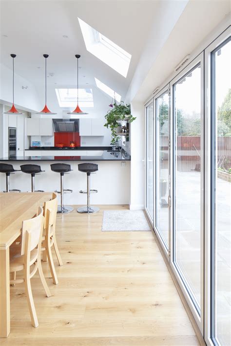 White aluminium bi-fold doors to rear home extension in Sussex | Brighton Architects ...