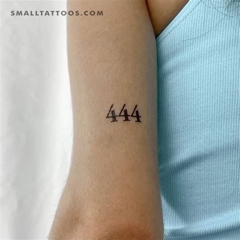 "444" angel number temporary tattoo placed on the inner