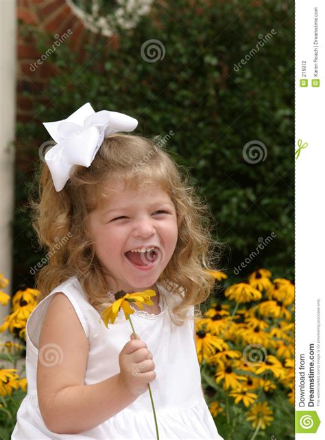 Girl Laughing and Holding Flower Stock Photo - Image of child, female: 216972