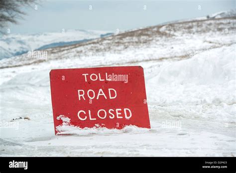 A toll road closed sign due to winter snow off the A39 near Porlock, Somerset, UK Stock Photo ...