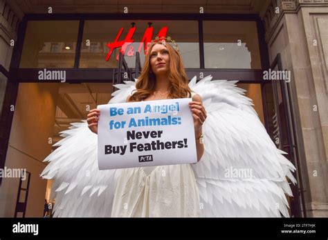 London, UK. 20th December 2023. A PETA activist dressed as an angel ...